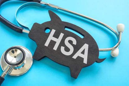 HSA health savings account. Stethoscope and piggy bank.