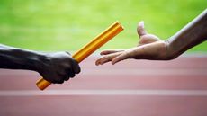 runners passing a baton